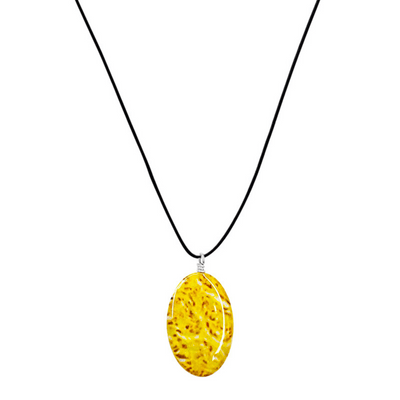 close up of yellow sarcoma necklace with oval cell image resin pendant on adjustable black cord