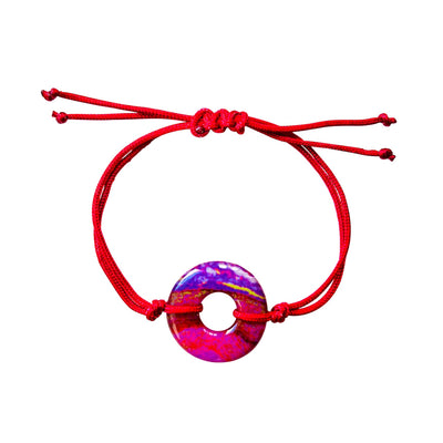 red adjustable cord bracelet for heart disease awareness that gives back to charity