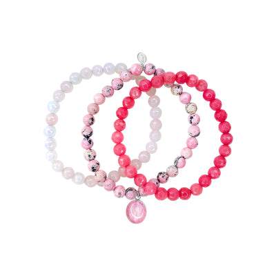 Pink jade, rose quartz, rhodochrosite breast cancer bracelets with breast cancer oval resin pendant.