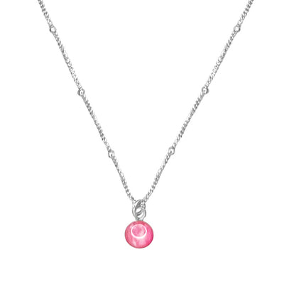 Close up of pink breast cancer awareness chain necklace that gives back to charity