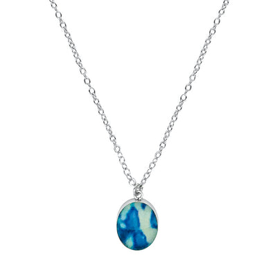 close up of Childhood cancer awareness necklace with blue and white oval pendant on chain gives back to charity