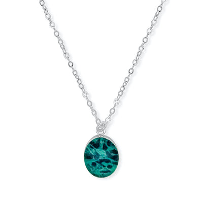 Close up of round Ovarian Cancer necklace in sterling silver. 