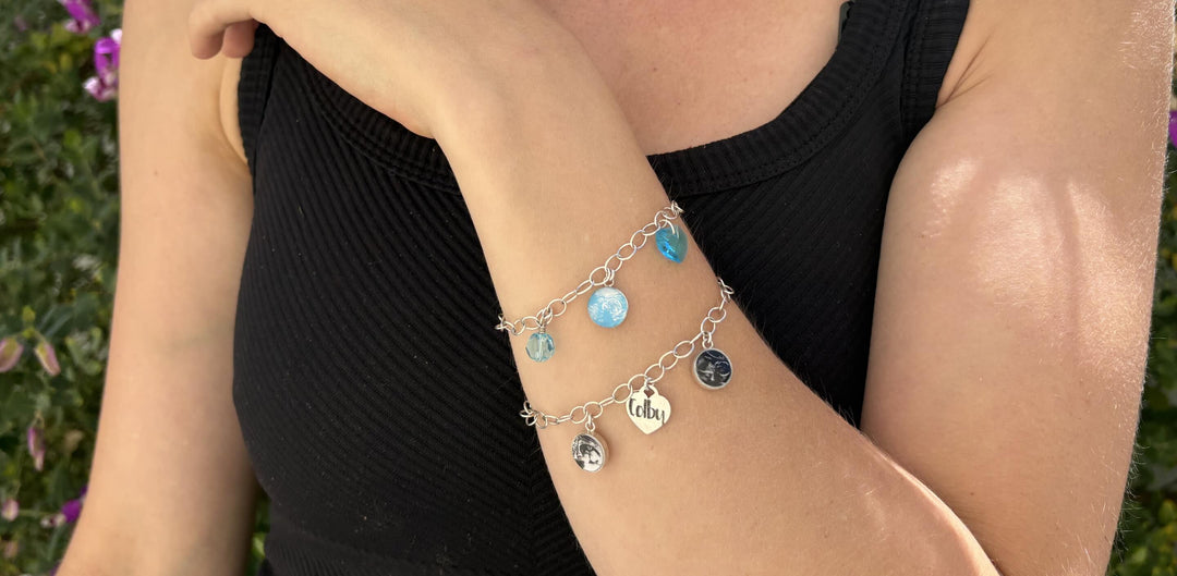 woman wearing custom embryo and sonogram image jewelry charm bracelets