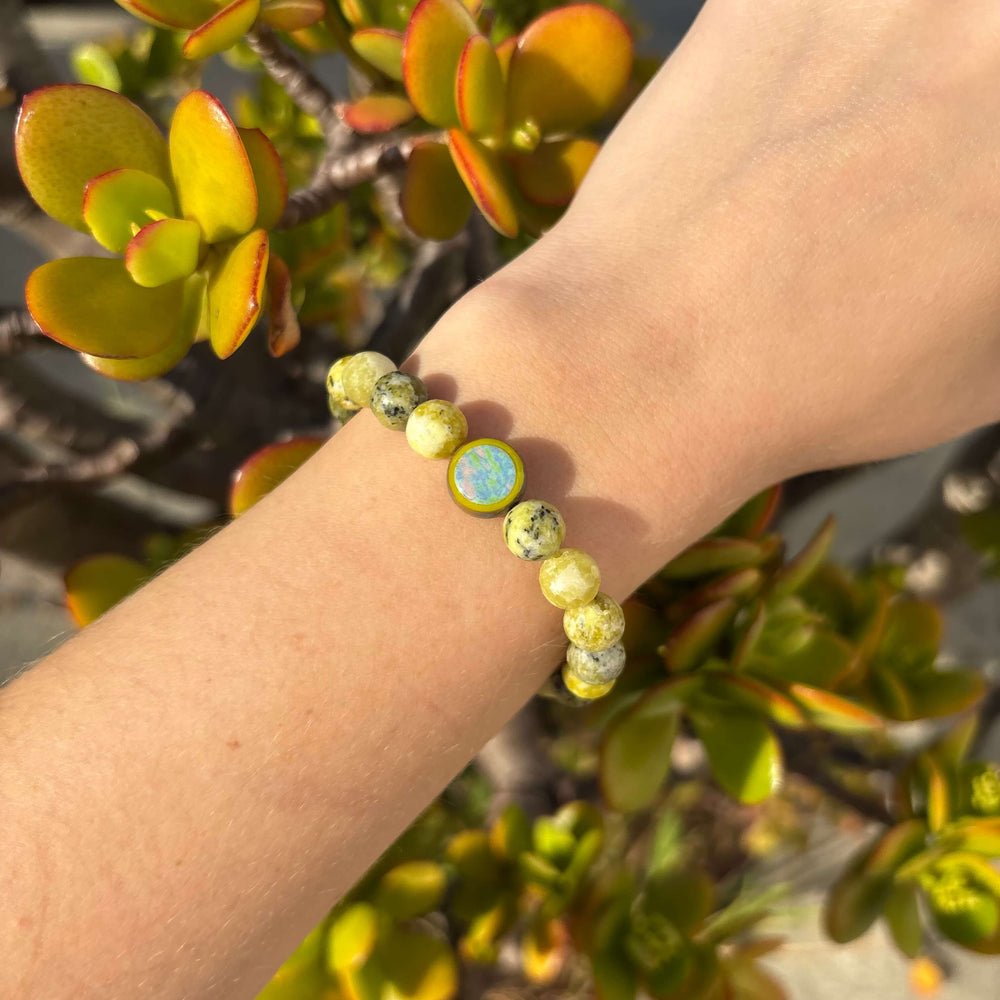 natural yellow turquoise stone stretch bracelet with alzheimer's cell image in resin pendant on model