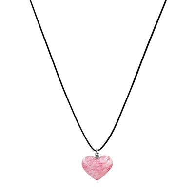 close up of pink breast cancer necklace with heart shaped cell image resin pendant on adjustable black cord