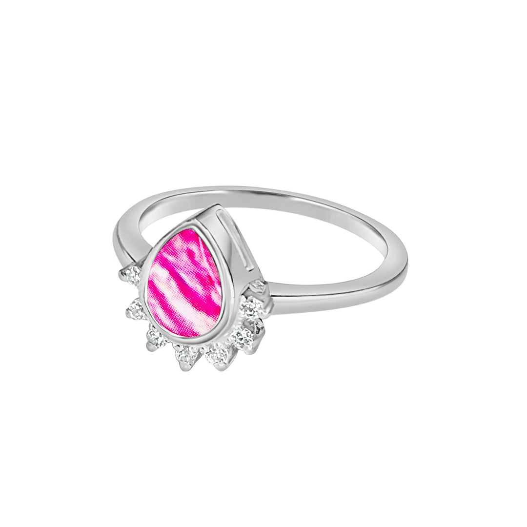 Sterling silver teardrop shaped ring with half halo of cubic zirconia stones and breast cancer cell image under resin pendant side view