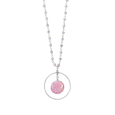 close up of breast cancer circle pendant with pink quartz in Sterling silver