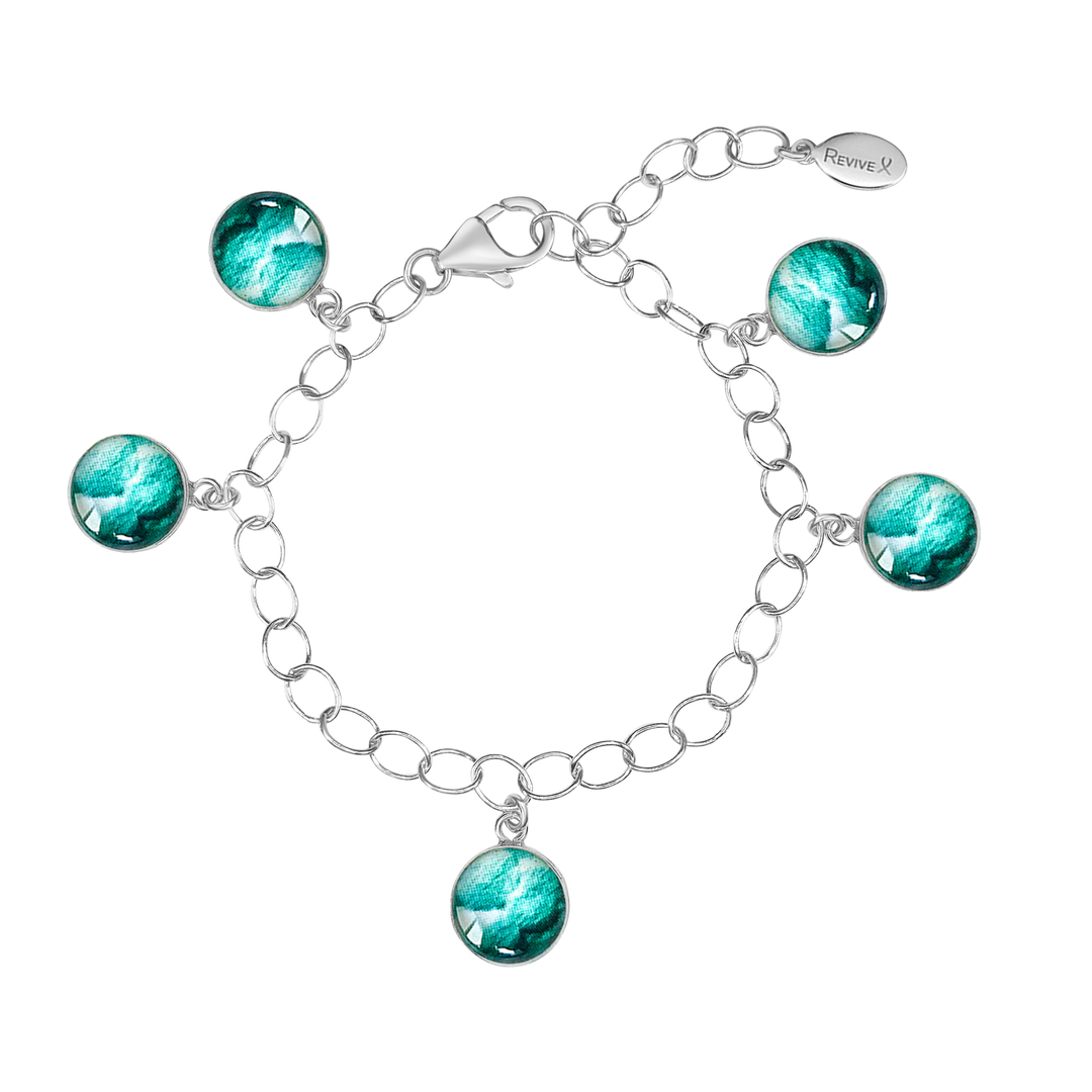 Silver chain bracelet with teal pendants showing embryo images on a white background
