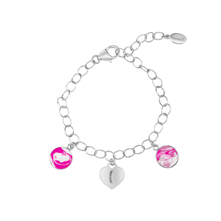Silver bracelet with pink pendants showing sonogram images and an engraved heart-shaped charm on a white background