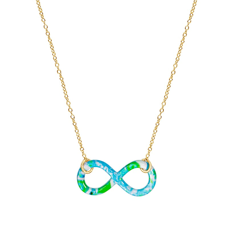 close up of Alzheimer's cell image infinity symbol pendant with resin and gold filled chain necklace