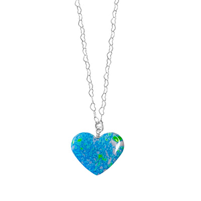 close up of heart shaped alzheimer's awareness necklace with long Sterling silver heart chain and heart shaped cell image in resin pendant