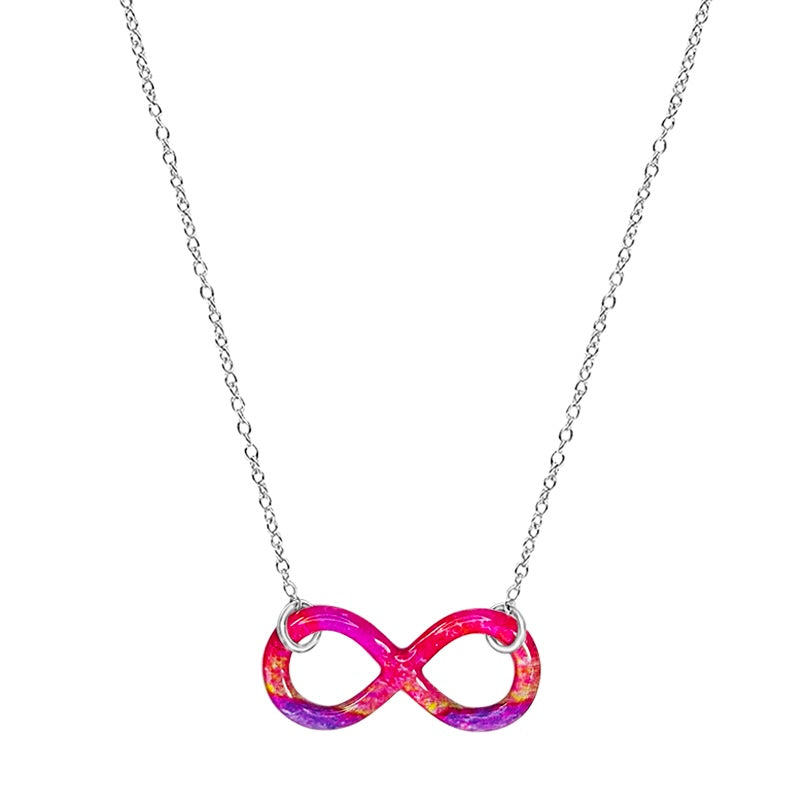 close up of infinity symbol pendant with heart disease cell image in resin on Sterling silver adjustable chain 