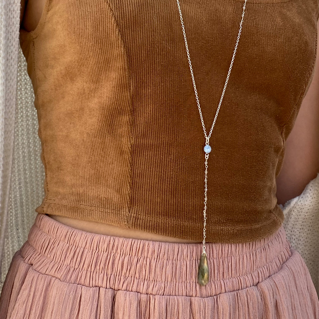 Model wearing Blue Multiple Sclerosis necklace in sterling silver with labradorite stones