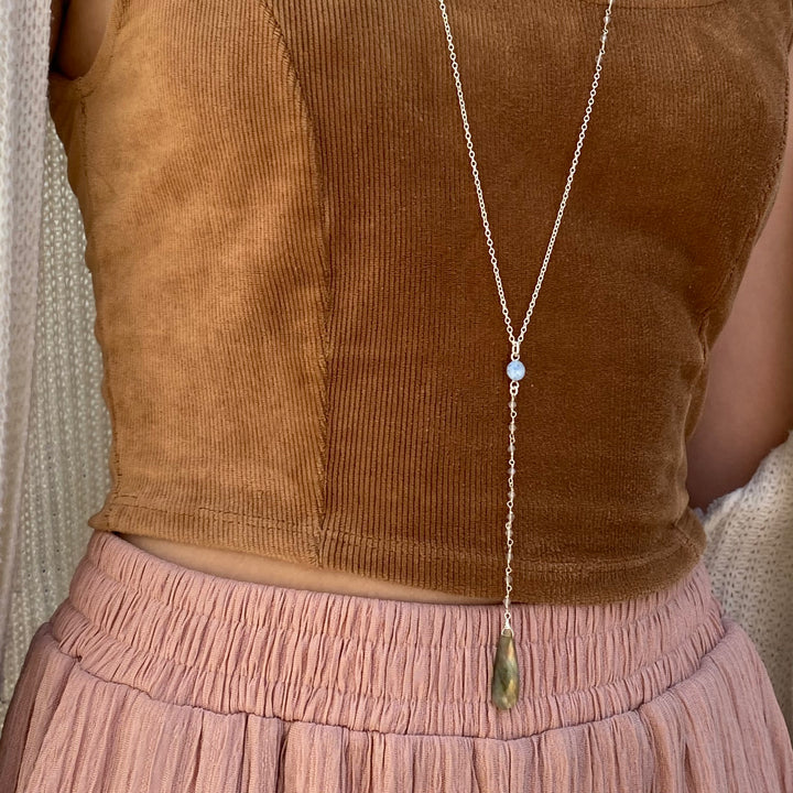 Model wearing Blue Multiple Sclerosis necklace in sterling silver with labradorite stones