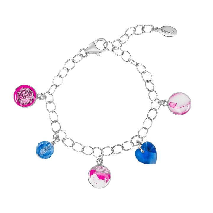 Silver bracelet with pink pendants showing the IVF journey from embryo to baby with blue birthstone crystals on a white background
