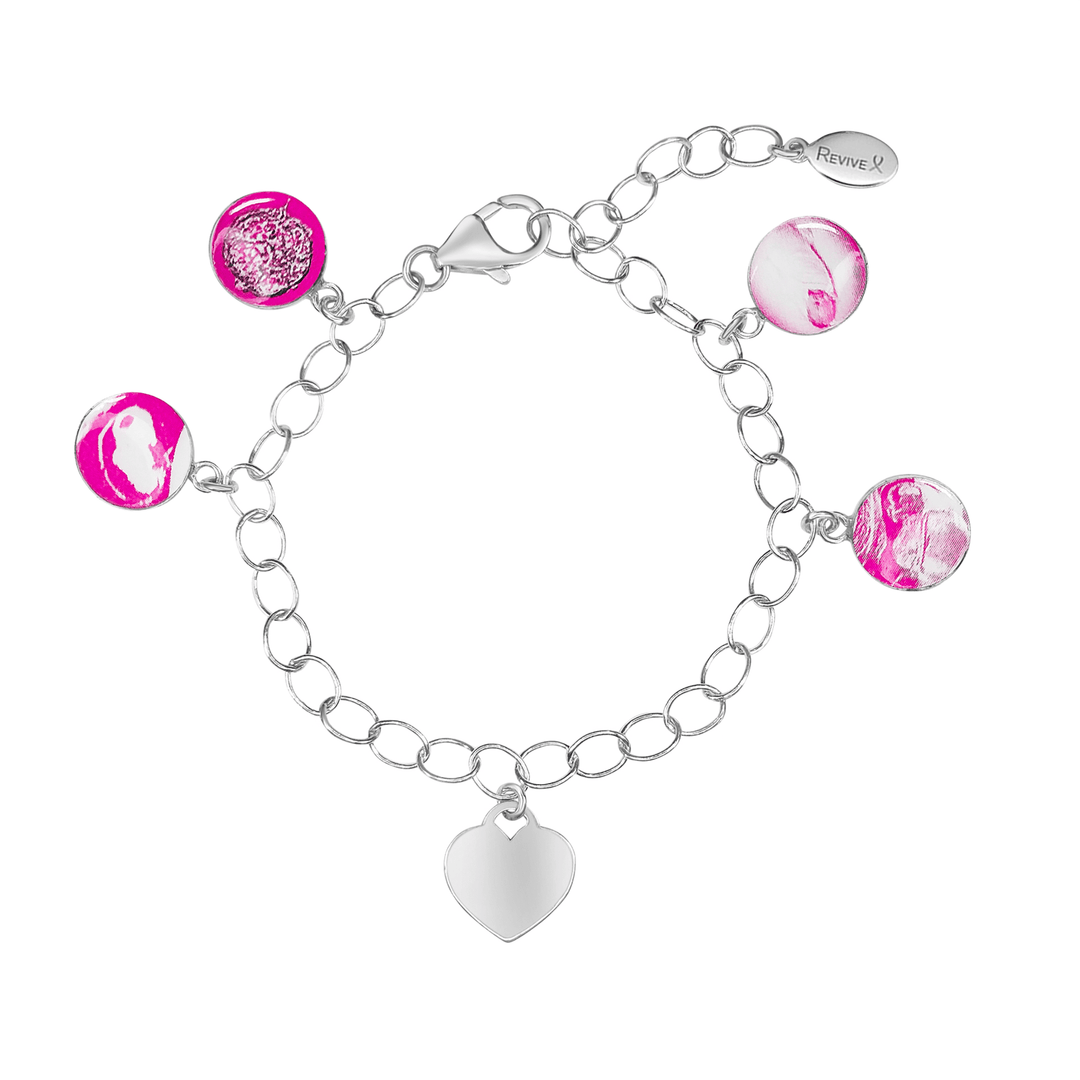 Silver bracelet with pink pendants showing the IVF journey from embryo to baby and an engravable heart-shaped charm on a white background