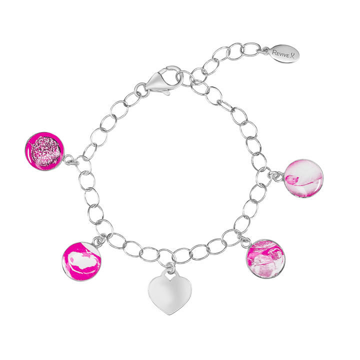 Silver bracelet with pink pendants showing the IVF journey from embryo to baby and an engravable heart-shaped charm on a white background