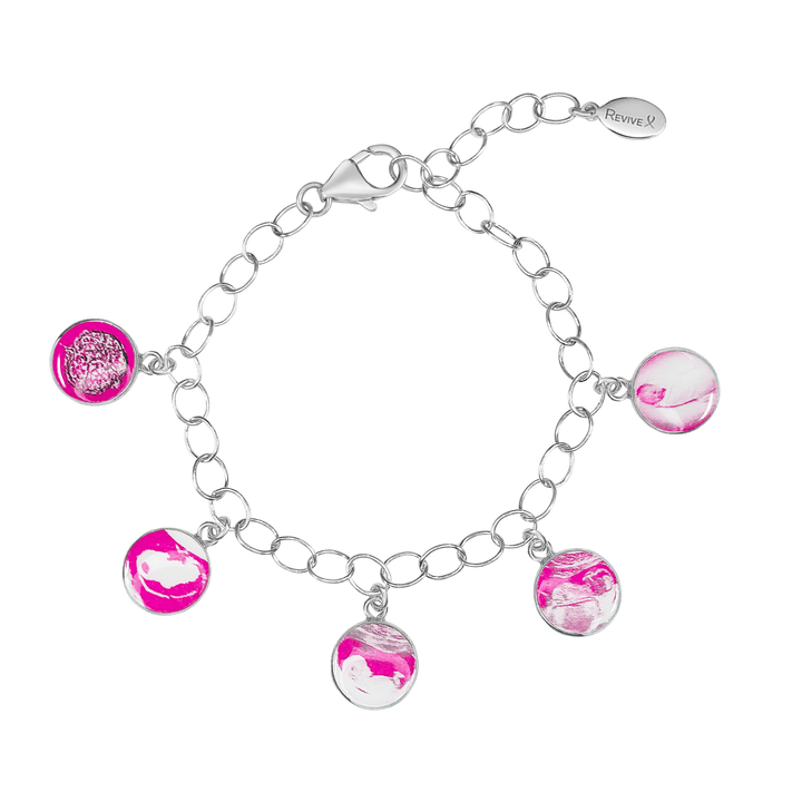 Silver bracelet with pink pendants showing the IVF journey from embryo to baby on a white background