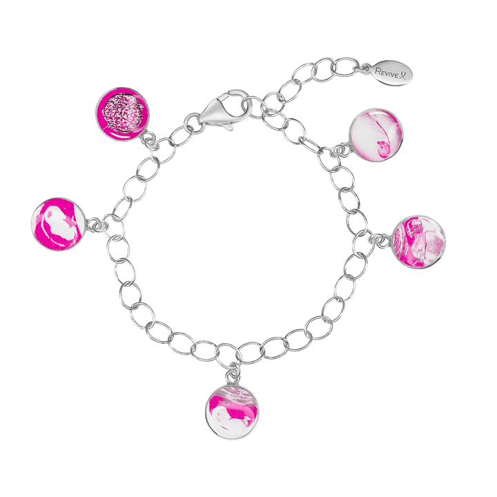 Silver bracelet with pink pendants showing the IVF journey from embryo to baby on a white background