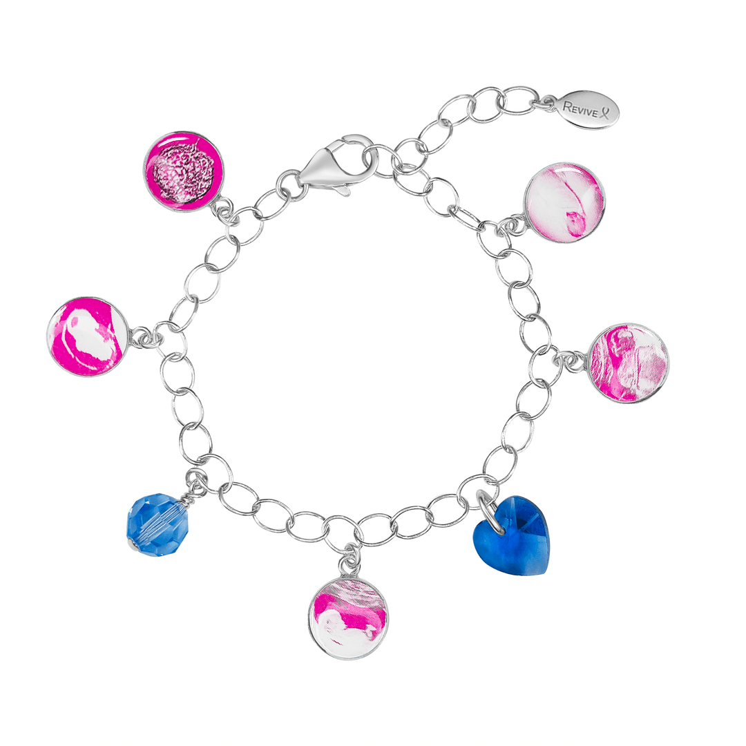 Silver bracelet with pink pendants showing the IVF journey from embryo to baby with Blue birthstone crystals on a white background