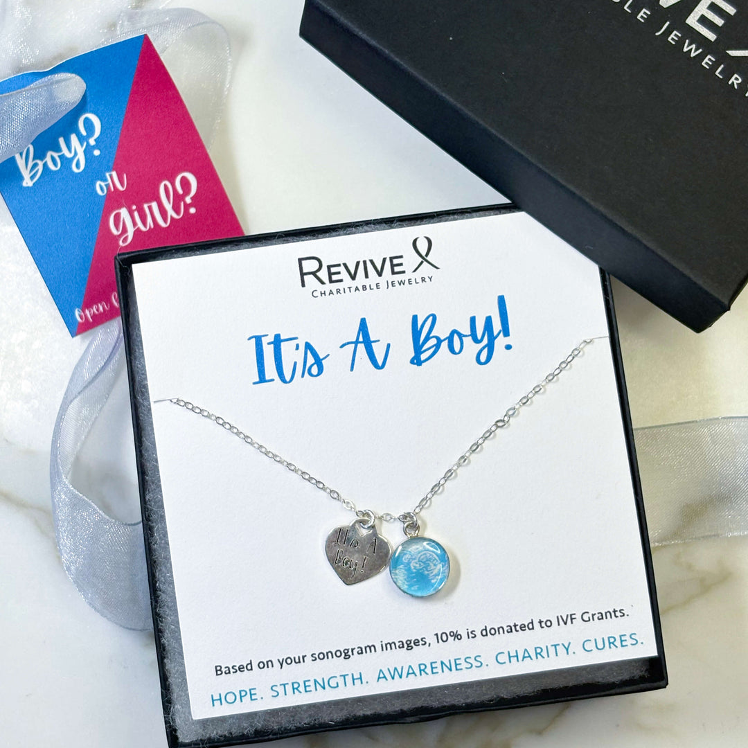 Silver Necklace with Blue Sonogram Image Pendant and "It's A Boy!" Heart-Shaped Engraved Charm in Product Packaging