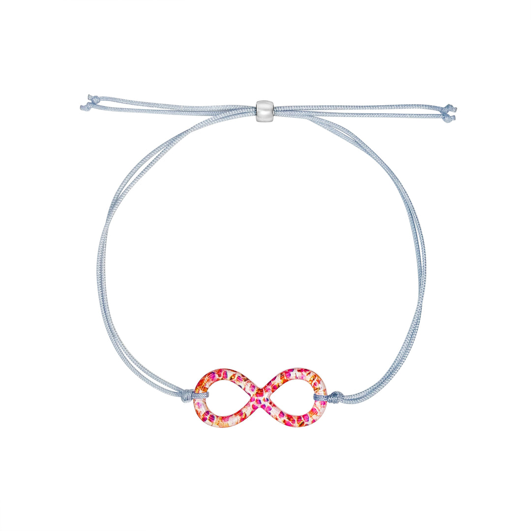 infinity pendant with orange leukemia cell image in resin on adjustable gray cord with Sterling silver slide bead