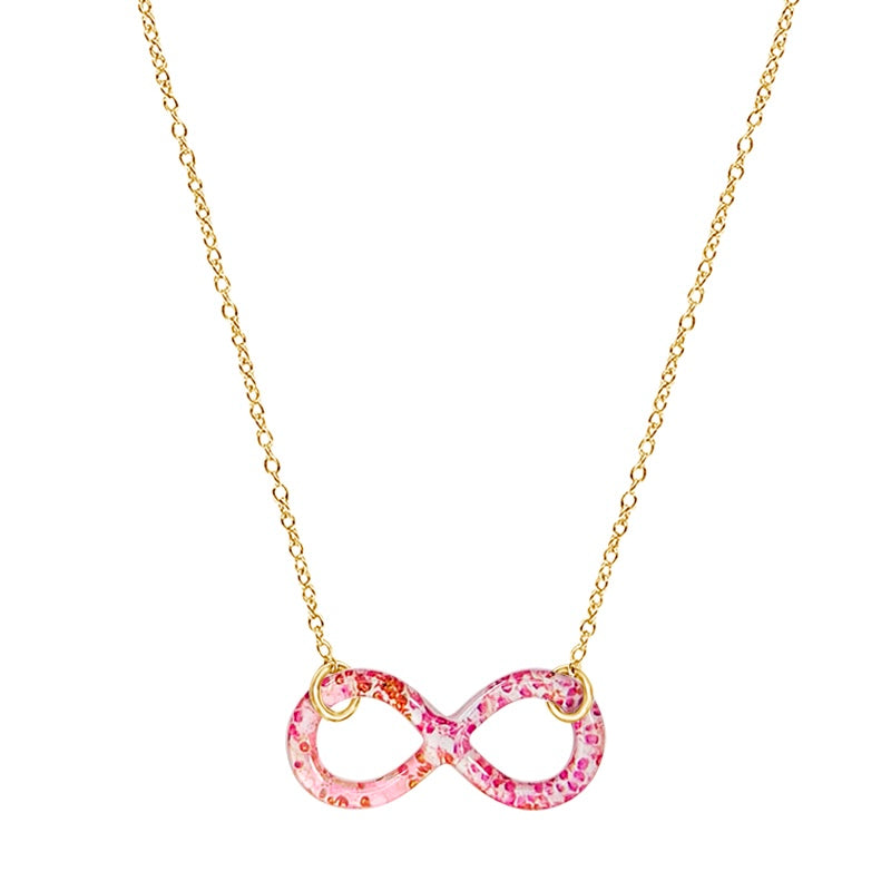 close up of infinity pendant with orange leukemia cell image in resin on gold filled adjustable chain