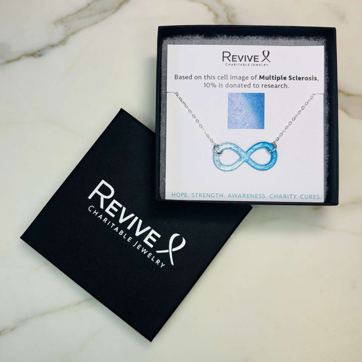 infinity pendant necklace with multiple sclerosis cell image in resin on sterling silver adjustable chain  with product packaging 