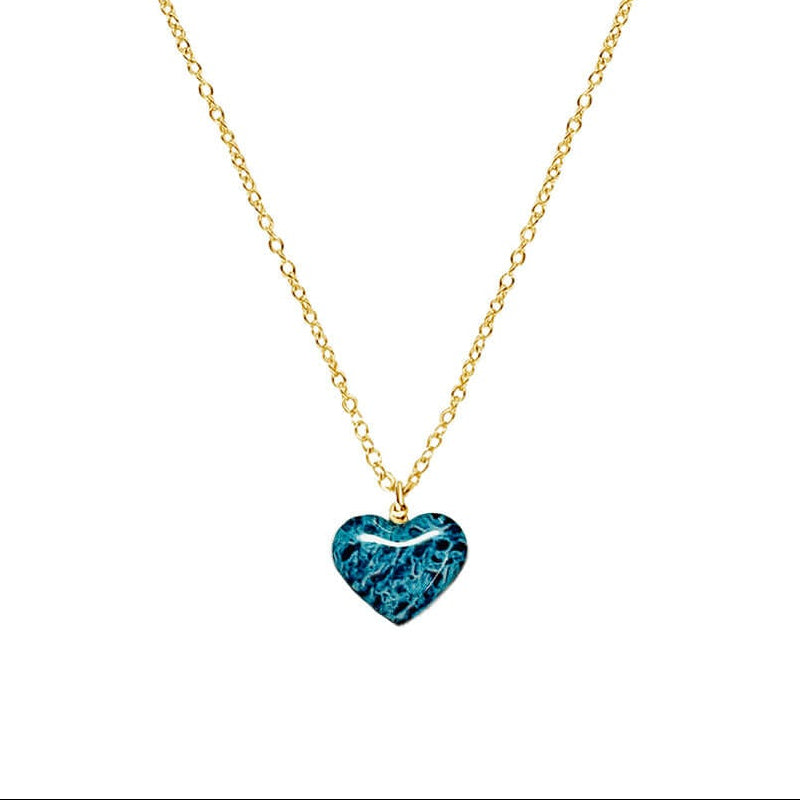 close up of heart shaped necklace with ovarian cancer awareness cell image in resin pendant on 14k gold filled chain
