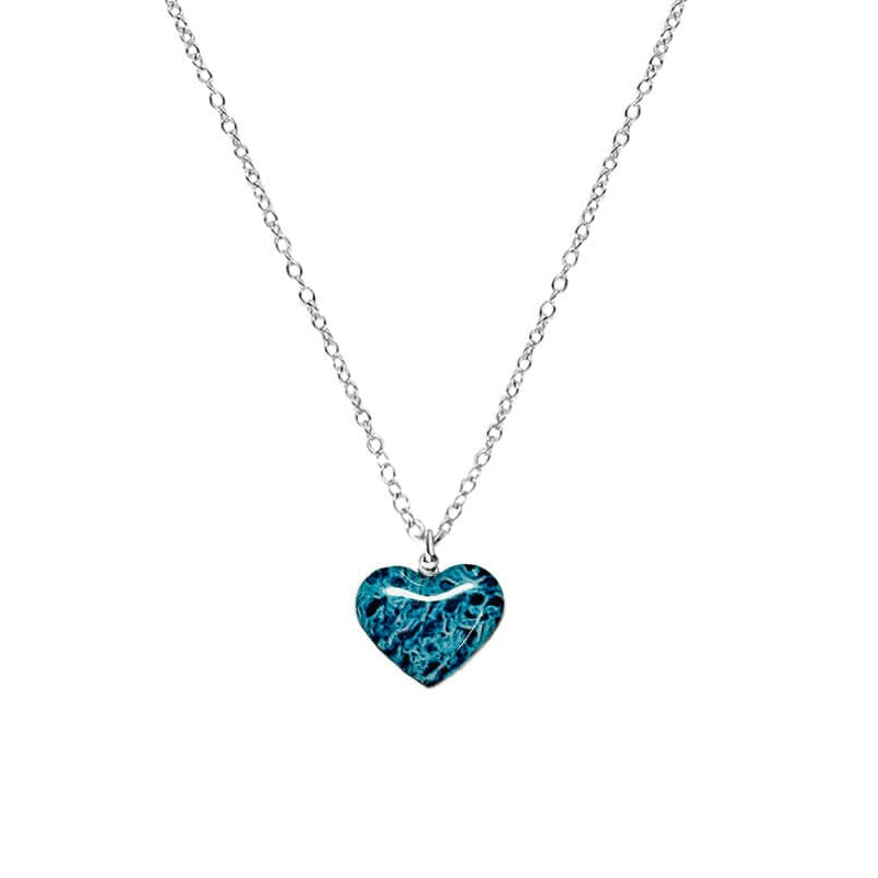 Close up of heart shaped necklace with ovarian cancer awareness cell image in resin pendant on sterling silver chain