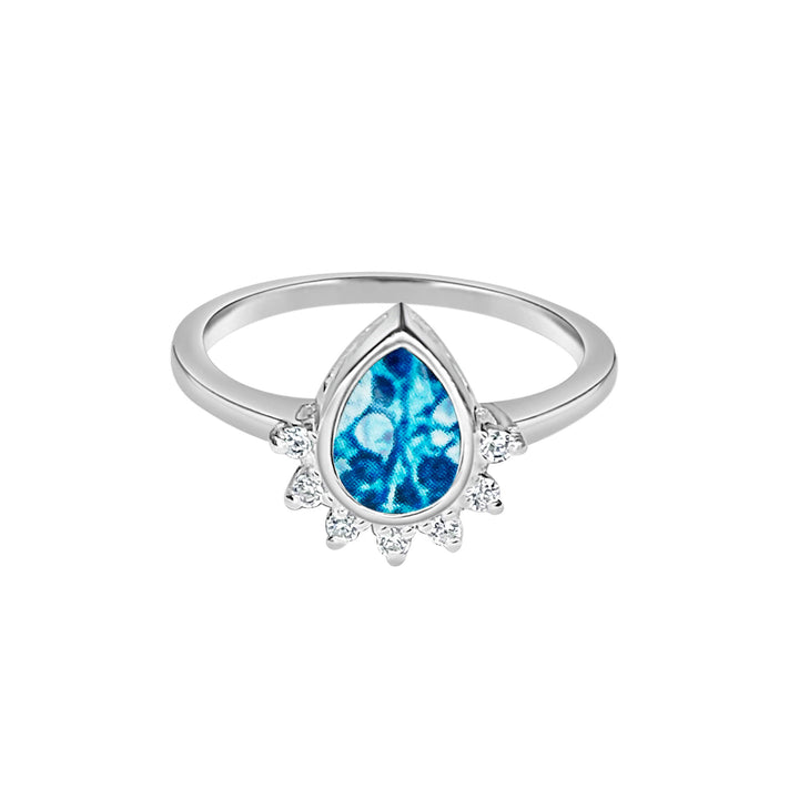 Sterling silver teardrop shaped ring with half halo of cubic zirconia stones and ovarian cancer cell image under resin pendant