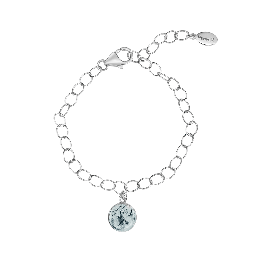 Silver bracelet with a grayscale sonogram pendant on a white background