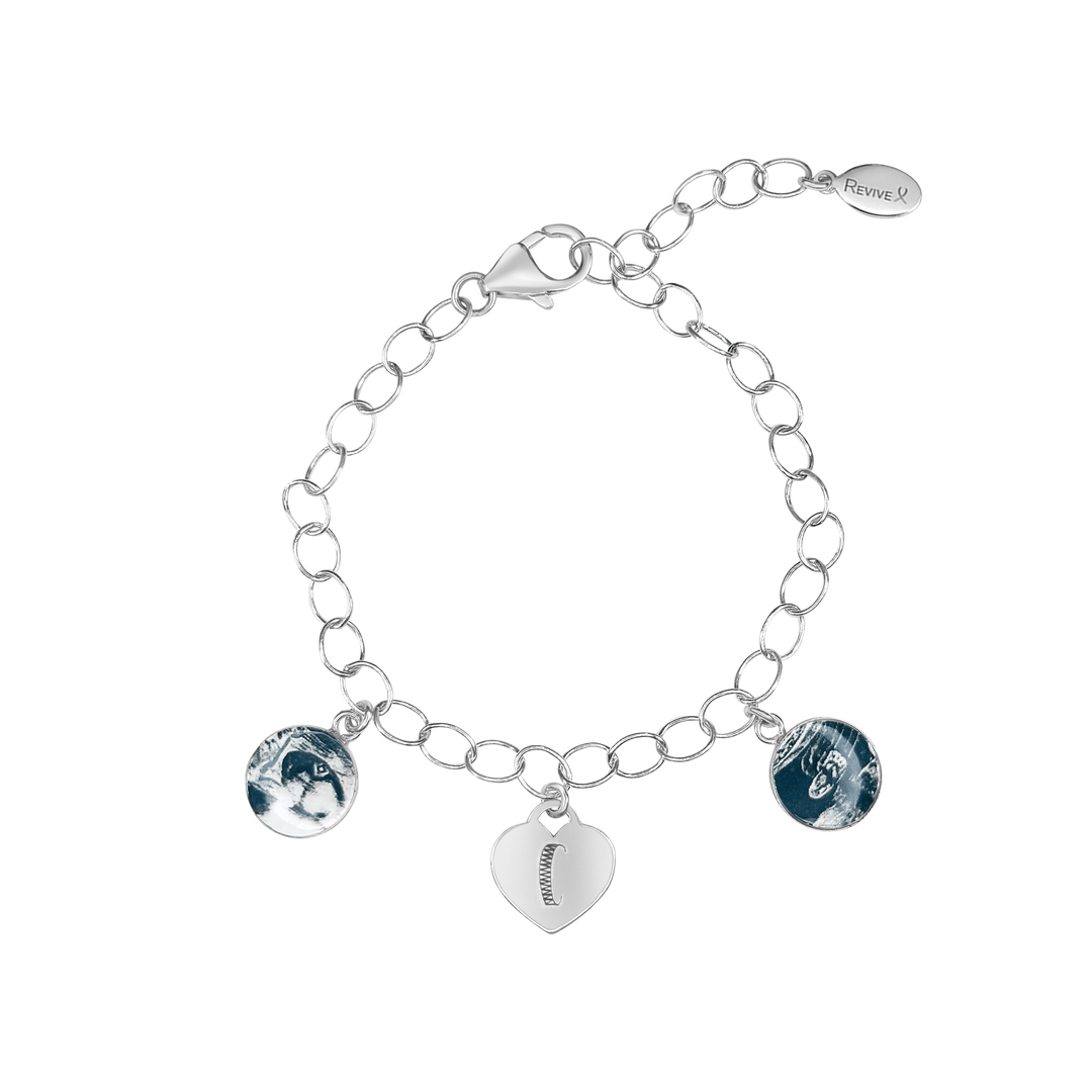 Silver bracelet with grayscale sonogram pendants and an heart charm engraved with the letter "C" on a white background