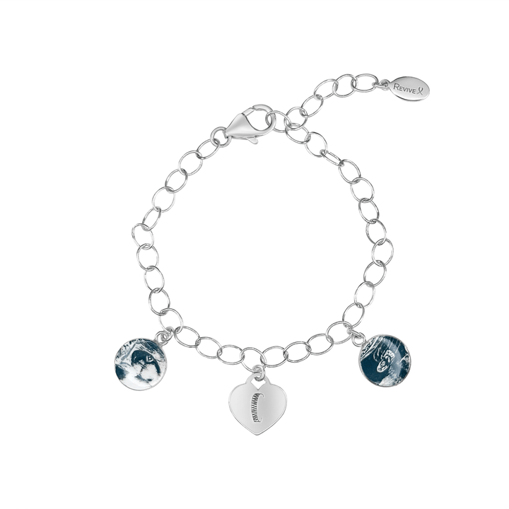 Silver bracelet with grayscale sonogram pendants and an heart charm engraved with the letter "C" on a white background