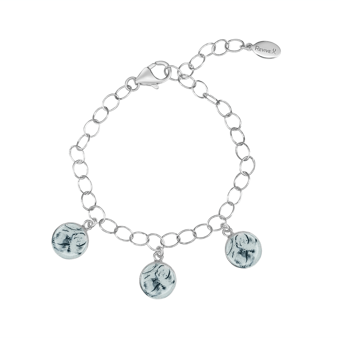 Silver bracelet with grayscale sonogram pendants on a white background