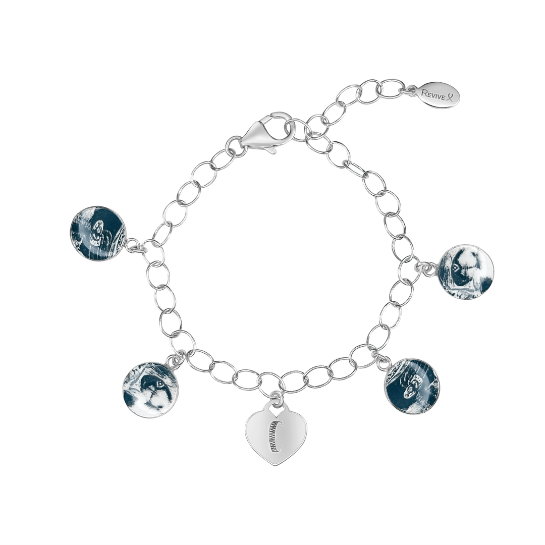 Silver bracelet with grayscale sonogram pendants and an heart charm engraved with the letter "C" on a white background