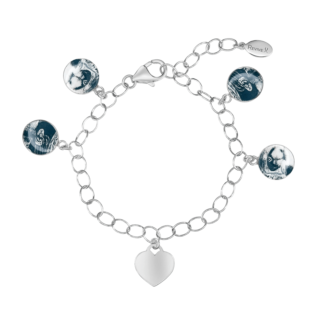 Silver bracelet with grayscale sonogram pendants and a blank heart-shaped charm on a white background