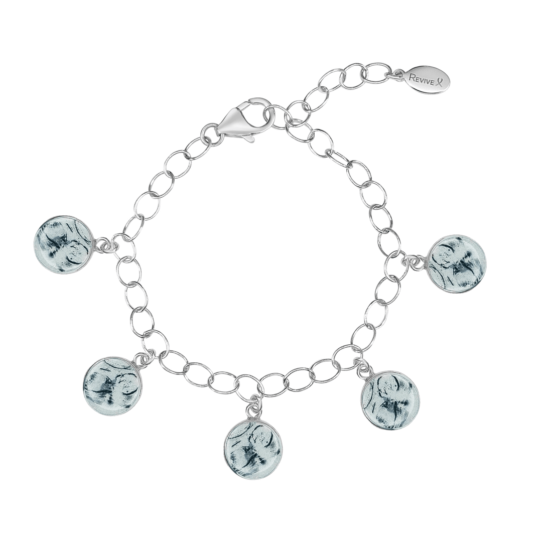 Silver bracelet with grayscale sonogram pendants on a white background