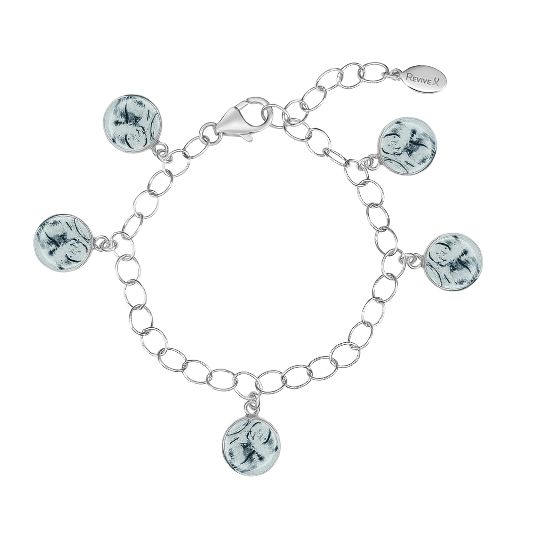 Silver bracelet with grayscale sonogram pendants on a white background