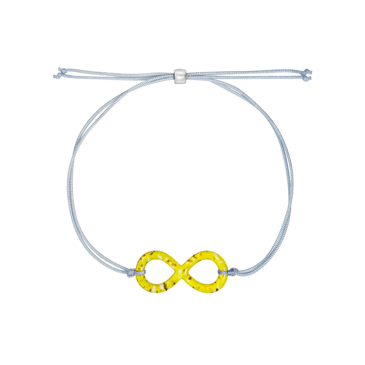 infinity pendant necklace with sarcoma cell image in resin on adjustable gray cord with Sterling silver slide bead 