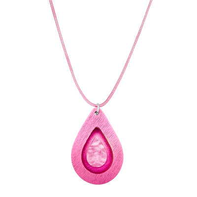 close up of pink teardrop pendant for breast cancer with wooden frame and sparkly resin surrounding cell image cut out on adjustable pink cord
