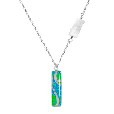 close up of Asymmetrical Alzheimer's Awareness Necklace with a blue and green Pendant in Sterling silver. 