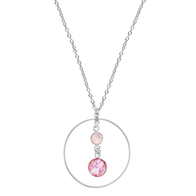 close up of circle pendant necklace for breast cancer with rose quartz stone and small round cell image pendant in Sterling silver on chain