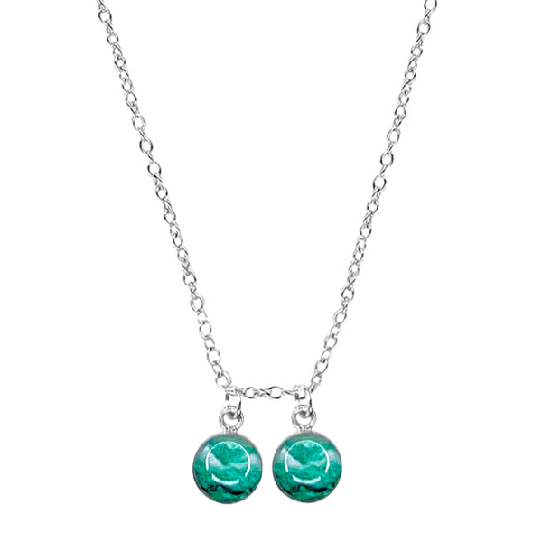 close up of custom fertility necklace in sterling silver with 2 pendants