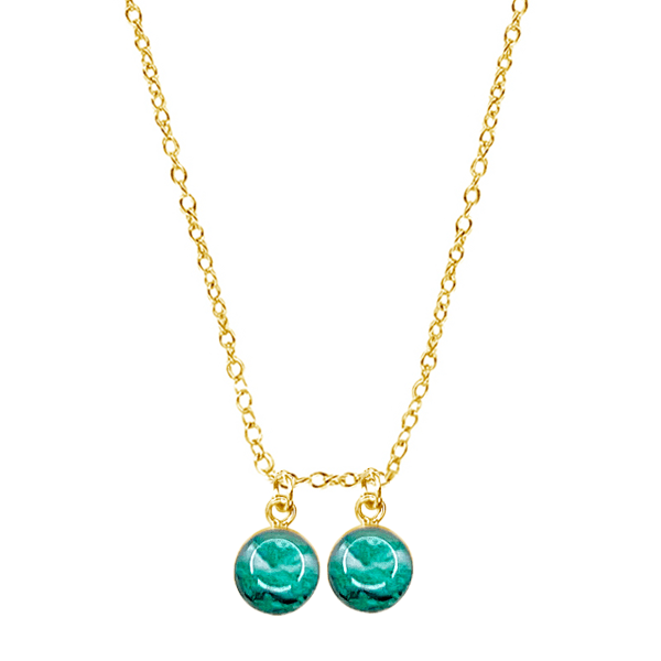 close up of custom fertility necklace in 14k gold filled with 2 pendants