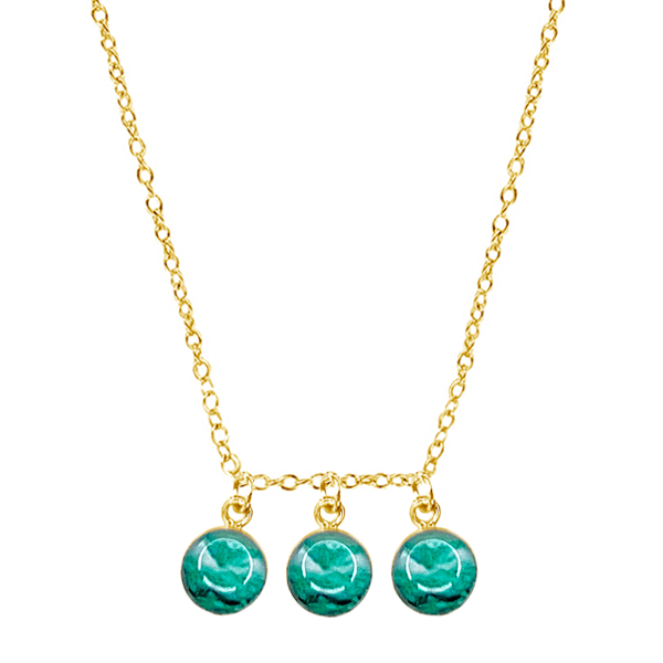 close up of custom fertility necklace in 14k gold filled with 3 pendants