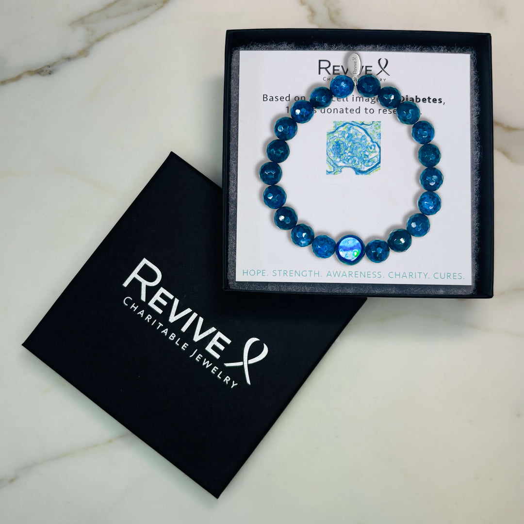 dark blue dumortierite stone stretch bracelet with diabetes cell image in resin pendant with product packaging