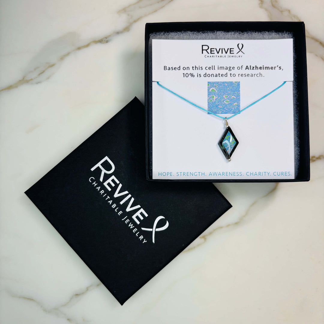 diamond shaped african turquoise stone pendant necklace on aqua cord featuring Alzheimer's cell image with product packaging