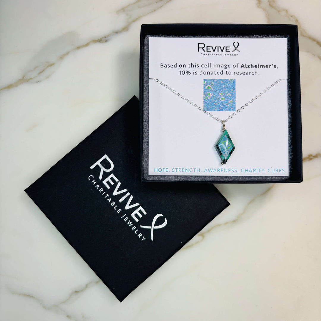 diamond shaped african turquoise stone pendant necklace on sterling silver chain featuring Alzheimer's cell image with product packaging