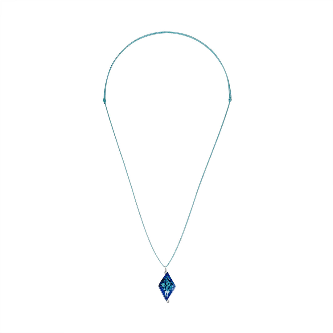 diamond shaped dark blue lapis stone pendant necklace on teal cord featuring ovarian cancer cell image in resin